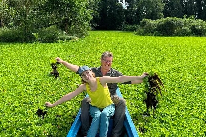 Discover Mua Xuan Nature Reserve - The boat ride through hyacinth-covered canals