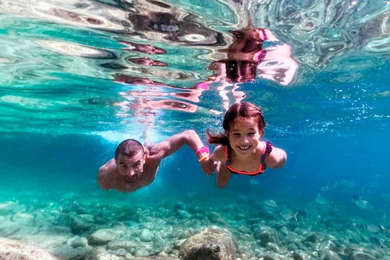 From Pula: Island Stop and National Park Day Cruise - Snorkeling, swimming, and peacock watching