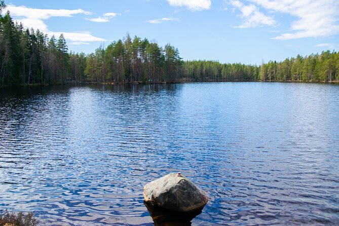 Helsinki: Nuuksio National park hiking with campfire lunch - Seven kilometers of forest, lakes, and rocky trails