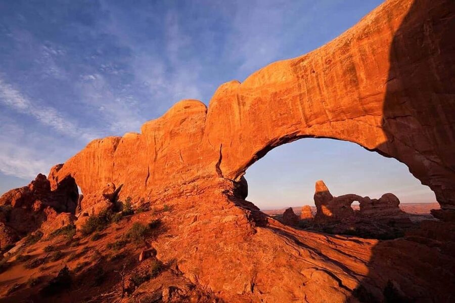 Moab: Arches National Park Sunset Tour - Riding through the park in a wide-window vehicle