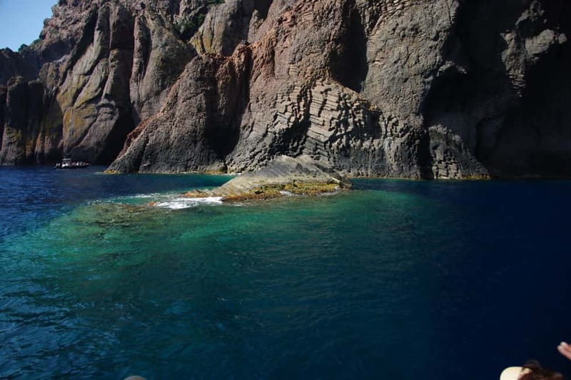 Porto: Scandola Nature Reserve and Creeks of Piana Boat Tour - Leaving Ota and rounding Capo Rosso