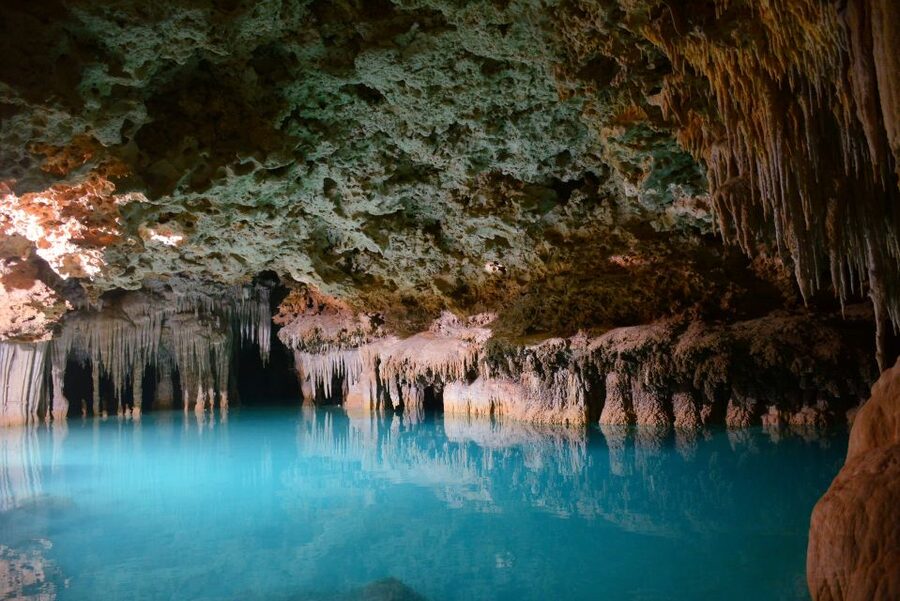 Rio Secreto Nature Reserve: Bicycle, Rappel & Ziplines Tour - Entering the underground river