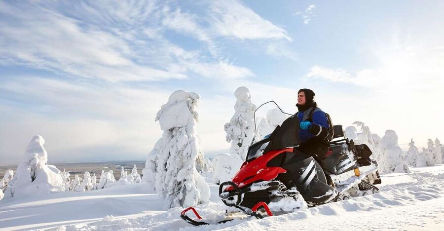 Rovaniemi: Guided Wilderness Snowmobile Ride - Getting suited up for Arctic weather