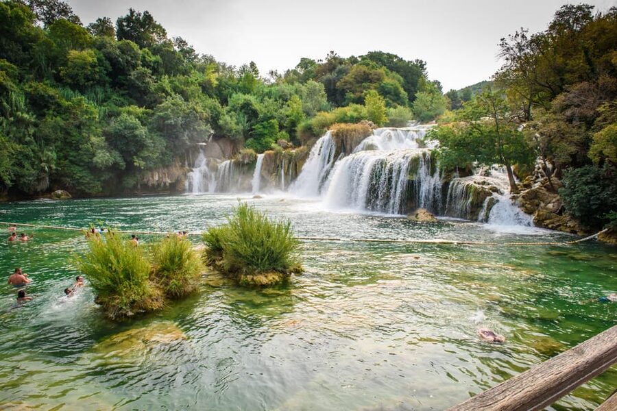 Split/Trogir: Krka National Park Day Trip & Boat to Skradin - Walking beside Skradinski Buk